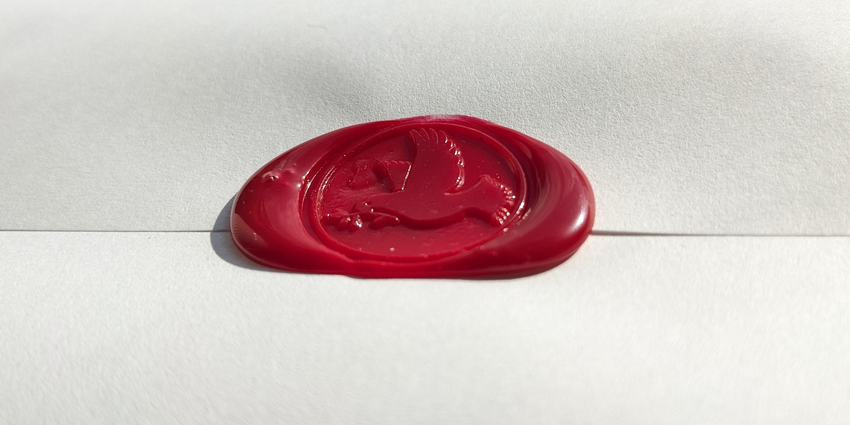 A wax seal of a dove sealing a letter